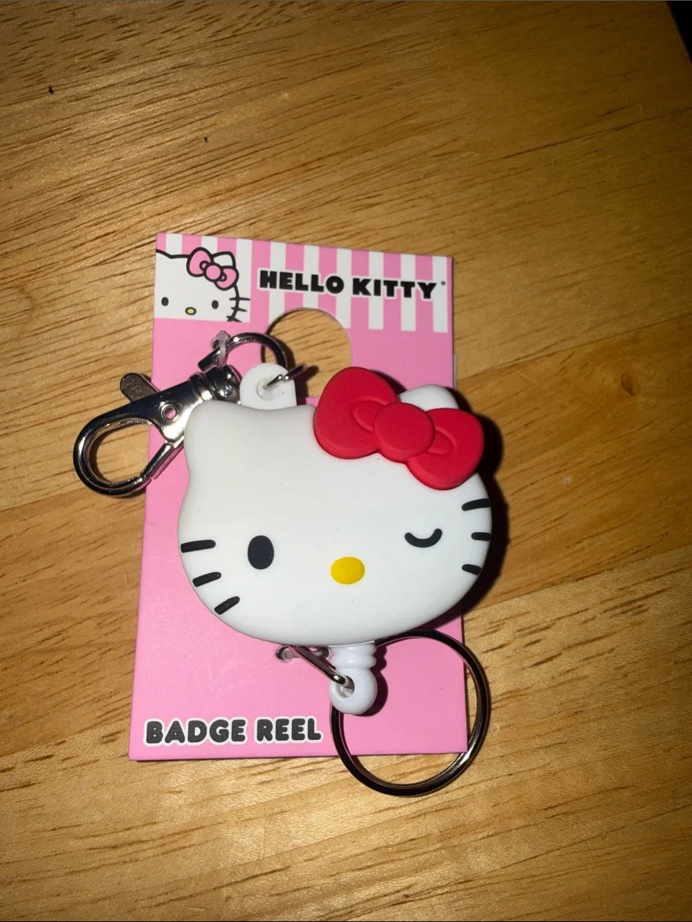 Hello Kitty White and Red Winking Badge Reel Keychain